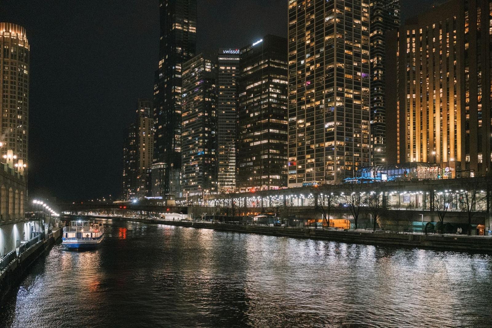 Chicago River and illuminated skyline at night